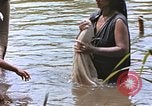 Image of Natives washing clothes in a river Leyte Philippines, 1945, second 58 stock footage video 65675059733