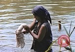 Image of Natives washing clothes in a river Leyte Philippines, 1945, second 62 stock footage video 65675059733