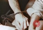 Image of wounded Marines Pacific Ocean, 1945, second 15 stock footage video 65675059750