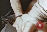 Image of wounded Marines Pacific Ocean, 1945, second 16 stock footage video 65675059750