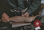 Image of wounded Marines Pacific Ocean, 1945, second 31 stock footage video 65675059750