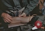 Image of wounded Marines Pacific Ocean, 1945, second 32 stock footage video 65675059750