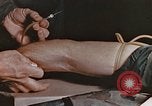 Image of wounded Marines Pacific Ocean, 1945, second 36 stock footage video 65675059750