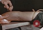 Image of wounded Marines Pacific Ocean, 1945, second 38 stock footage video 65675059750