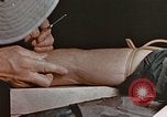 Image of wounded Marines Pacific Ocean, 1945, second 39 stock footage video 65675059750