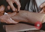 Image of wounded Marines Pacific Ocean, 1945, second 41 stock footage video 65675059750