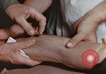 Image of wounded Marines Pacific Ocean, 1945, second 42 stock footage video 65675059750