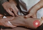 Image of wounded Marines Pacific Ocean, 1945, second 43 stock footage video 65675059750