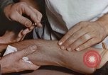 Image of wounded Marines Pacific Ocean, 1945, second 46 stock footage video 65675059750
