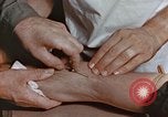 Image of wounded Marines Pacific Ocean, 1945, second 52 stock footage video 65675059750