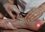 Image of wounded Marines Pacific Ocean, 1945, second 53 stock footage video 65675059750