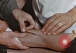 Image of wounded Marines Pacific Ocean, 1945, second 54 stock footage video 65675059750