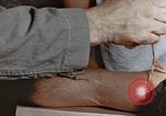 Image of wounded Marines Pacific Ocean, 1945, second 56 stock footage video 65675059750