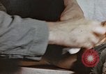 Image of wounded Marines Pacific Ocean, 1945, second 57 stock footage video 65675059750