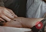 Image of wounded Marines Pacific Ocean, 1945, second 59 stock footage video 65675059750
