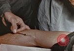 Image of wounded Marines Pacific Ocean, 1945, second 60 stock footage video 65675059750