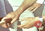 Standbild Tennis champion Bobbie Riggs demonstriert Schläger Grip Waikiki Hawaii USA, 1945, aus Sekunde 3 historischem Filmmaterial Videoclip 65675059779