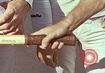 Standbild Tennis champion Bobbie Riggs demonstriert Schläger Grip Waikiki Hawaii USA, 1945, aus Sekunde 9 historischem Filmmaterial Videoclip 65675059779