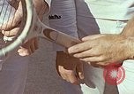 Standbild Tennis champion Bobbie Riggs demonstriert Schläger Grip Waikiki Hawaii USA, 1945, aus Sekunde 12 historischem Filmmaterial Videoclip 65675059779