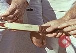 Standbild Tennis champion Bobbie Riggs demonstriert Schläger Grip Waikiki Hawaii USA, 1945, aus Sekunde 13 historischem Filmmaterial Videoclip 65675059779