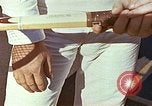Standbild Tennis champion Bobbie Riggs demonstriert Schläger Grip Waikiki Hawaii USA, 1945, aus Sekunde 29 historischem Filmmaterial Videoclip 65675059779