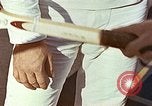 Standbild Tennis champion Bobbie Riggs demonstriert Schläger Grip Waikiki Hawaii USA, 1945, aus Sekunde 31 historischem Filmmaterial Videoclip 65675059779