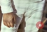 Standbild Tennis champion Bobbie Riggs demonstriert Schläger Grip Waikiki Hawaii USA, 1945, aus Sekunde 32 historischem Filmmaterial Videoclip 65675059779