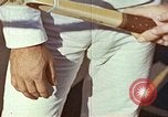 Standbild Tennis champion Bobbie Riggs demonstriert Schläger Grip Waikiki Hawaii USA, 1945, aus Sekunde 33 historischem Filmmaterial Videoclip 65675059779