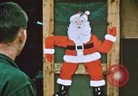 Image of troops celebrate Christmas Vietnam, 1968, second 6 stock footage video 65675059895