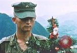 Image of troops celebrate Christmas Vietnam, 1968, second 25 stock footage video 65675059895