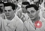 Image of standing watch United States USA, 1943, second 53 stock footage video 65675059920