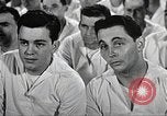 Image of standing watch United States USA, 1943, second 57 stock footage video 65675059920