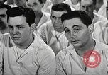 Image of standing watch United States USA, 1943, second 58 stock footage video 65675059920