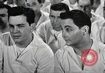 Image of standing watch United States USA, 1943, second 59 stock footage video 65675059920