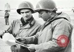 Immagine di Truppe alleate e attrezzature essendo portata a terra sulla spiaggia di Omaha Normandia Francia, 1944, secondo 14 filmato di repertorio 65675060099