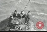 Immagine di Truppe alleate e attrezzature essendo portata a terra sulla spiaggia di Omaha Normandia Francia, 1944, secondo 30 filmato di repertorio 65675060099