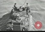 Immagine di Truppe alleate e attrezzature essendo portata a terra sulla spiaggia di Omaha Normandia Francia, 1944, secondo 31 filmato di repertorio 65675060099