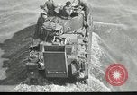 Immagine di Truppe alleate e attrezzature essendo portata a terra sulla spiaggia di Omaha Normandia Francia, 1944, secondo 32 filmato di repertorio 65675060099