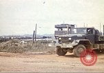 Image of empty dump trcuks Hue Vietnam, 1971, second 24 stock footage video 65675060130