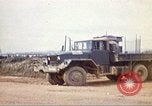 Image of empty dump trcuks Hue Vietnam, 1971, second 25 stock footage video 65675060130