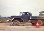 Image of empty dump trcuks Hue Vietnam, 1971, second 26 stock footage video 65675060130