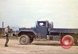 Image of empty dump trcuks Hue Vietnam, 1971, second 27 stock footage video 65675060130