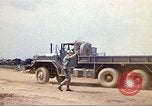 Image of empty dump trcuks Hue Vietnam, 1971, second 28 stock footage video 65675060130