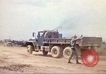 Image of empty dump trcuks Hue Vietnam, 1971, second 29 stock footage video 65675060130