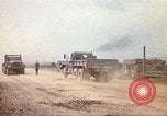 Image of empty dump trcuks Hue Vietnam, 1971, second 31 stock footage video 65675060130