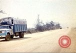 Image of empty dump trcuks Hue Vietnam, 1971, second 52 stock footage video 65675060130