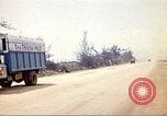Image of empty dump trcuks Hue Vietnam, 1971, second 53 stock footage video 65675060130