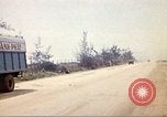 Image of empty dump trcuks Hue Vietnam, 1971, second 54 stock footage video 65675060130