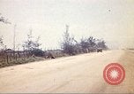 Image of empty dump trcuks Hue Vietnam, 1971, second 57 stock footage video 65675060130
