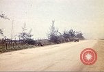 Image of empty dump trcuks Hue Vietnam, 1971, second 58 stock footage video 65675060130